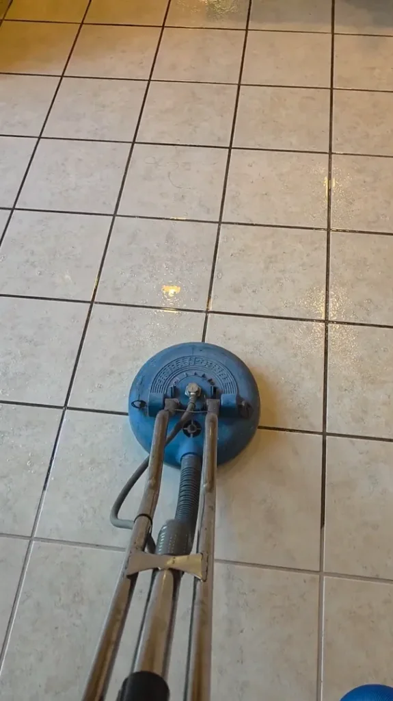 Commercial floor spinner cleaning large porcelain tile surfaces in a Winchester home