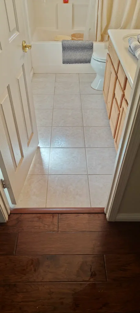 Professional hard surface spinner tool cleaning large format porcelain floor tiles in a San Jacinto home