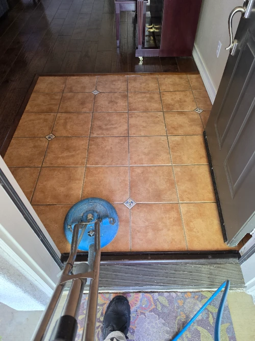Tile & Grout Cleaning in Fallbrook 7 rofessional hard surface spinner tool cleaning a premium travertine tile entryway with decorative diamond inserts in Fallbrook
