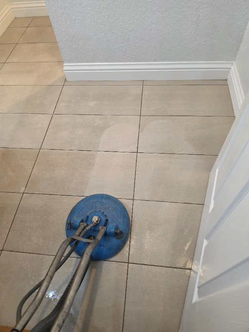 Tile & Grout Cleaning in Fallbrook 6 The Dirt Army's blue hard surface cleaner extraction machine removing embedded dirt from bathroom tile floors in Fallbrook