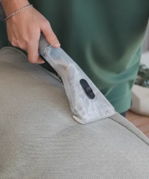 Local expert using a professional extraction tool for trusted upholstery cleaning in Fallbrook