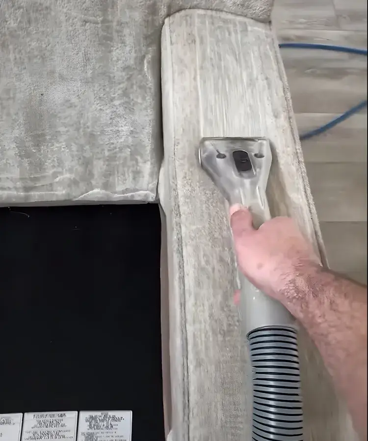 Upholstery Cleaning in Wildomar 7 Specialized clear hand tool performing deep upholstery cleaning in wildomar on a grey sofa armrest